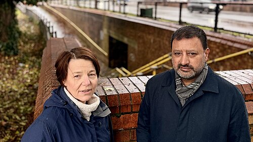 Hilary and Mahmoon next to flooded subway