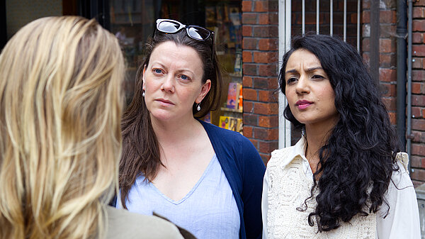 Sarah and Nazmeen listening 